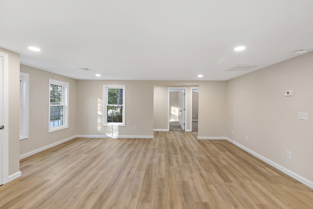 2 Womponoag Road Plymouth, MA 02360 - Photo 9 of 24 a view of empty room with wooden floor and fan