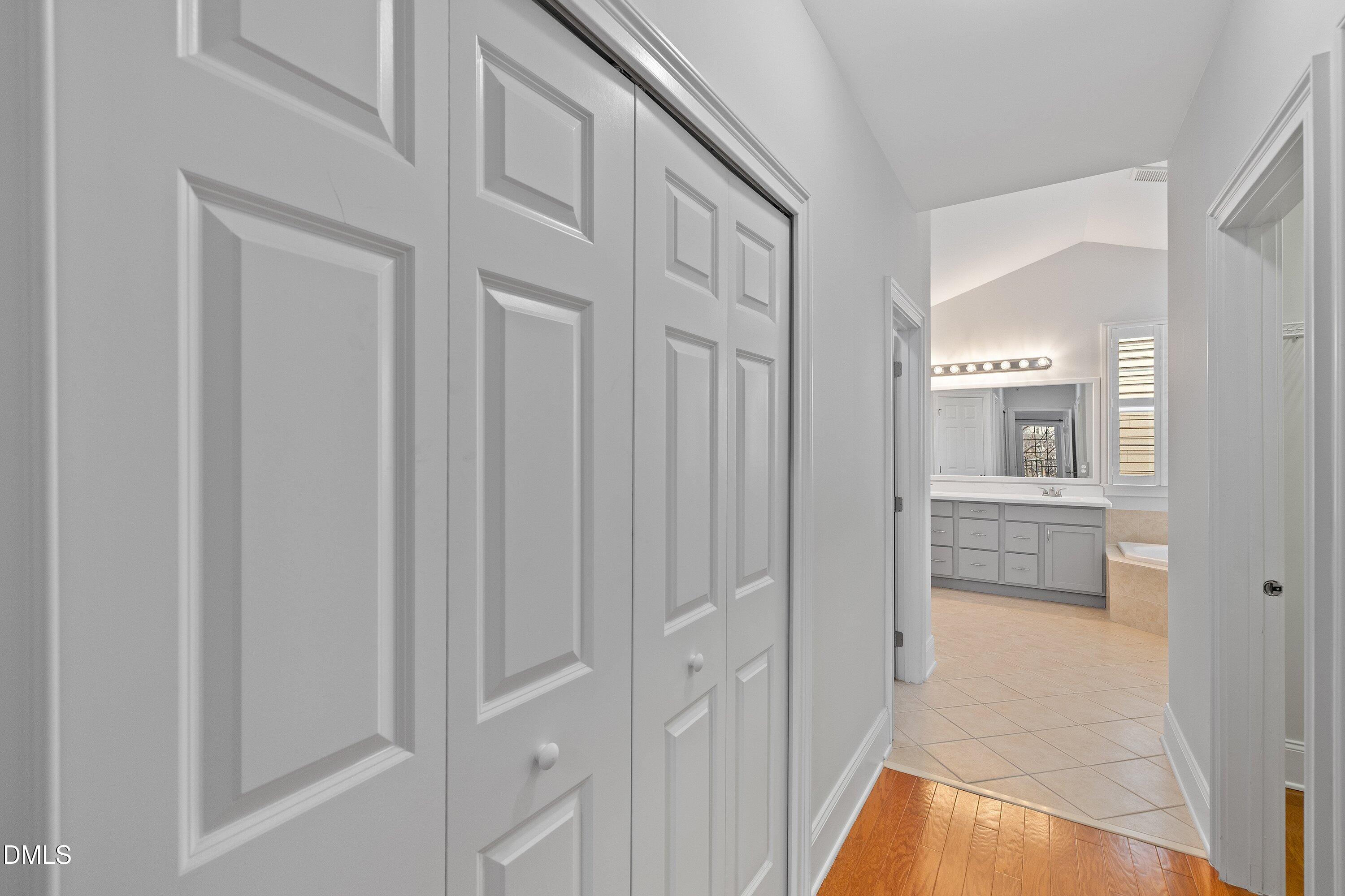 9211 Calabria Drive, Unit 205 Raleigh, NC 27617 - Photo 40 of 55 a view of a hallway with bathroom and bathroom