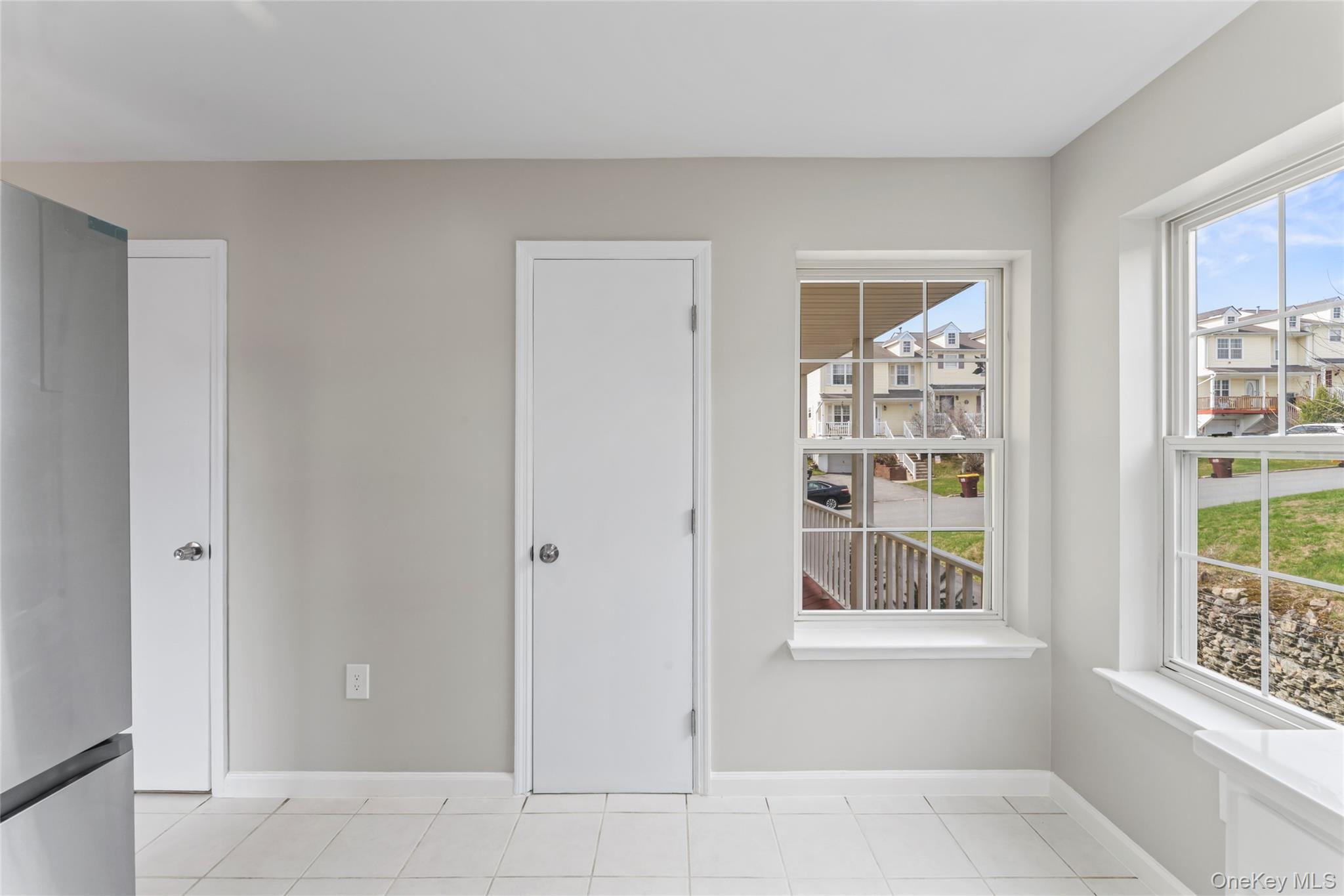 99 Evan Road Warwick, NY 10990 - Photo 11 of 27 an empty room with windows and cabinet