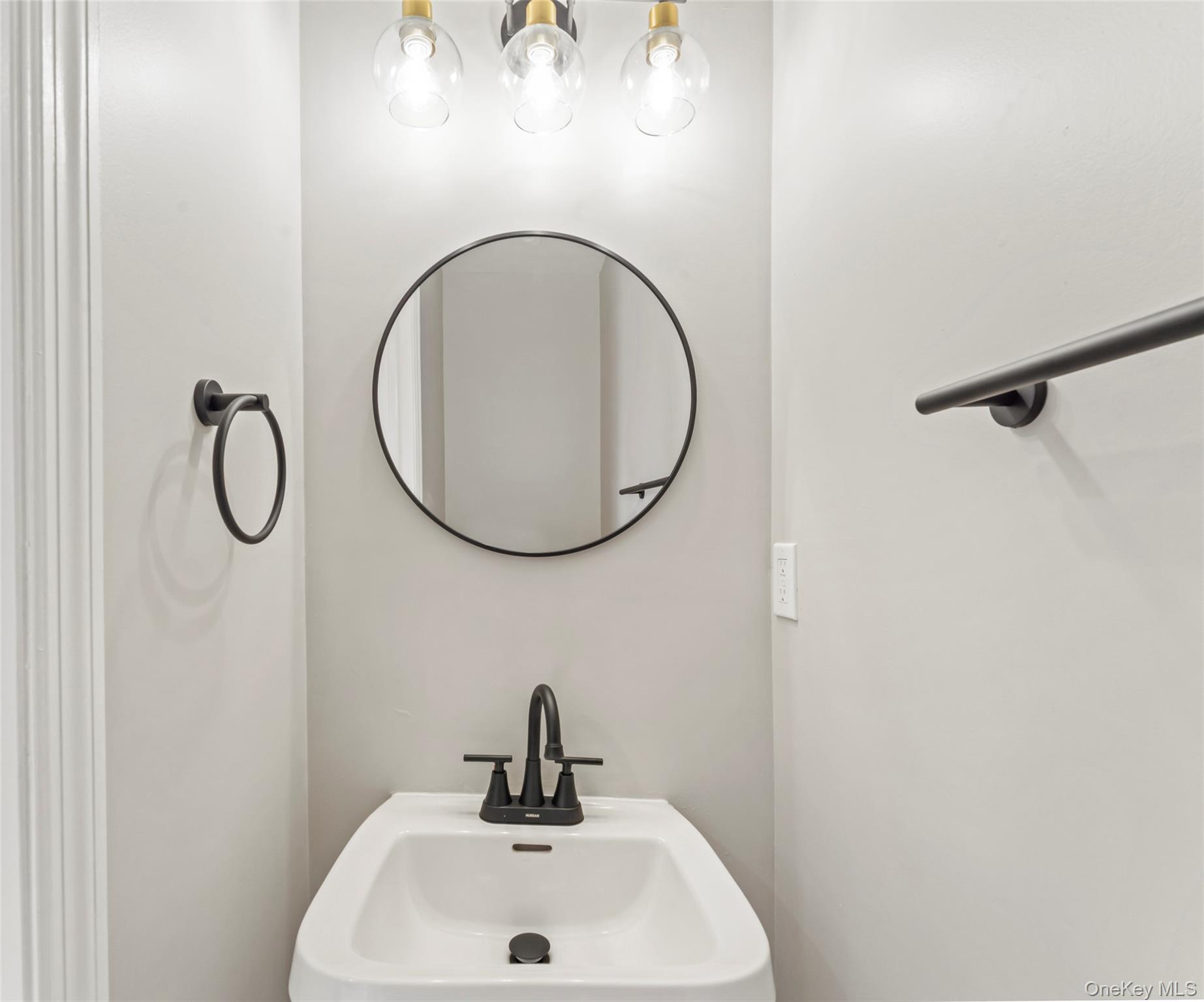 99 Evan Road Warwick, NY 10990 - Photo 12 of 27 a bathroom with a sink and mirror