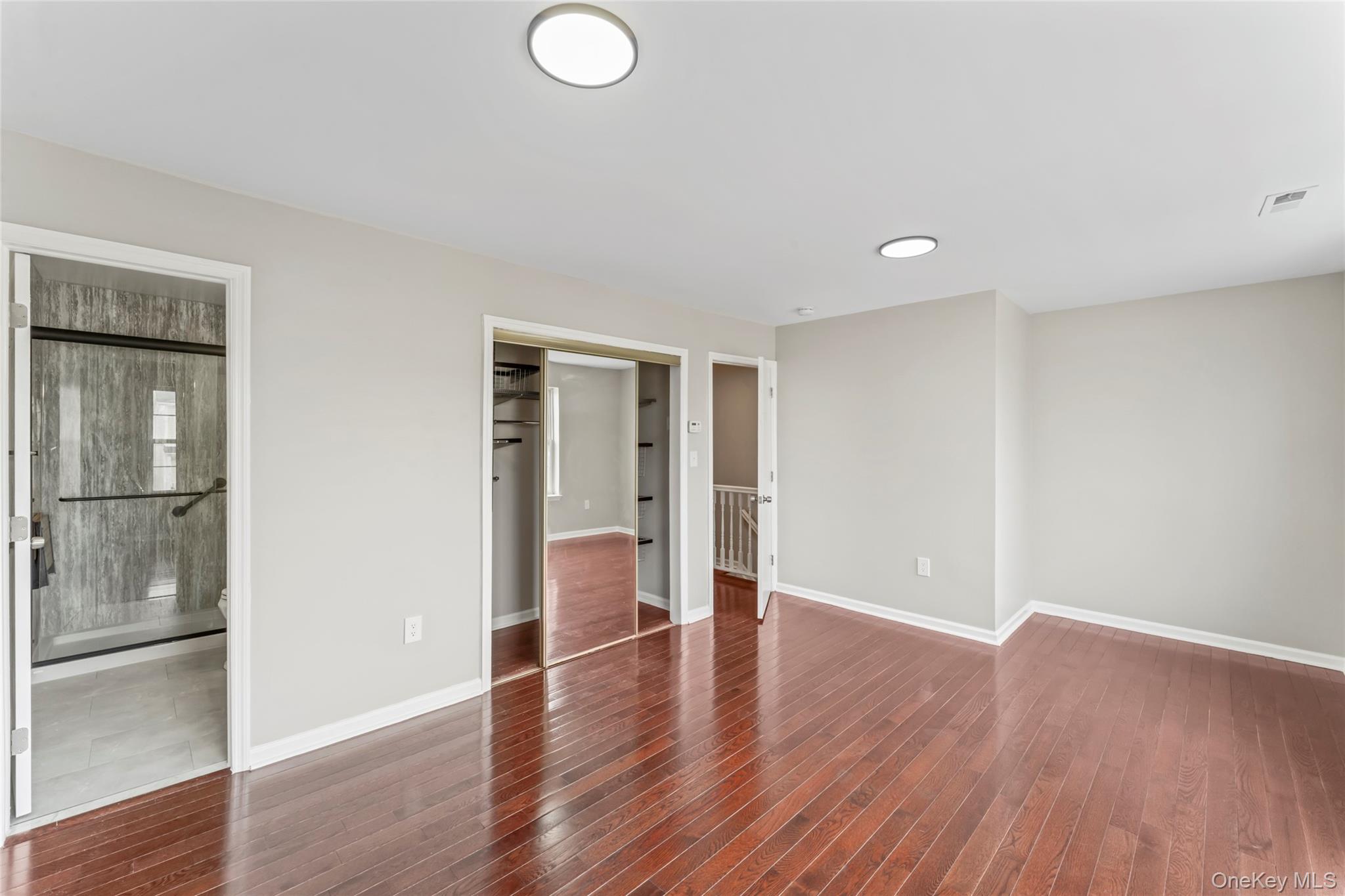 99 Evan Road Warwick, NY 10990 - Photo 14 of 27 a view of an empty room with wooden floor and windows