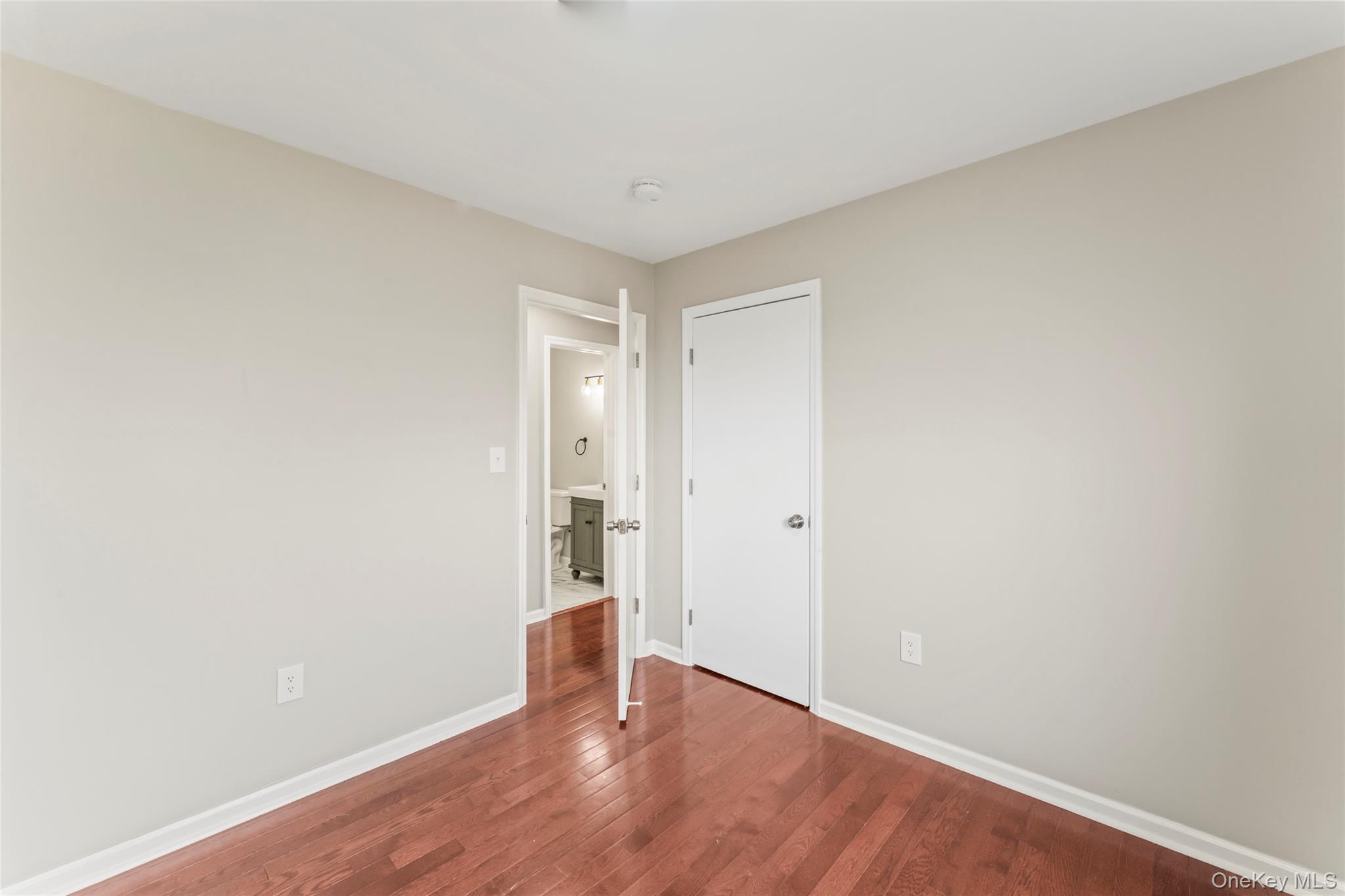 99 Evan Road Warwick, NY 10990 - Photo 18 of 27 a view of an empty room and wooden floor