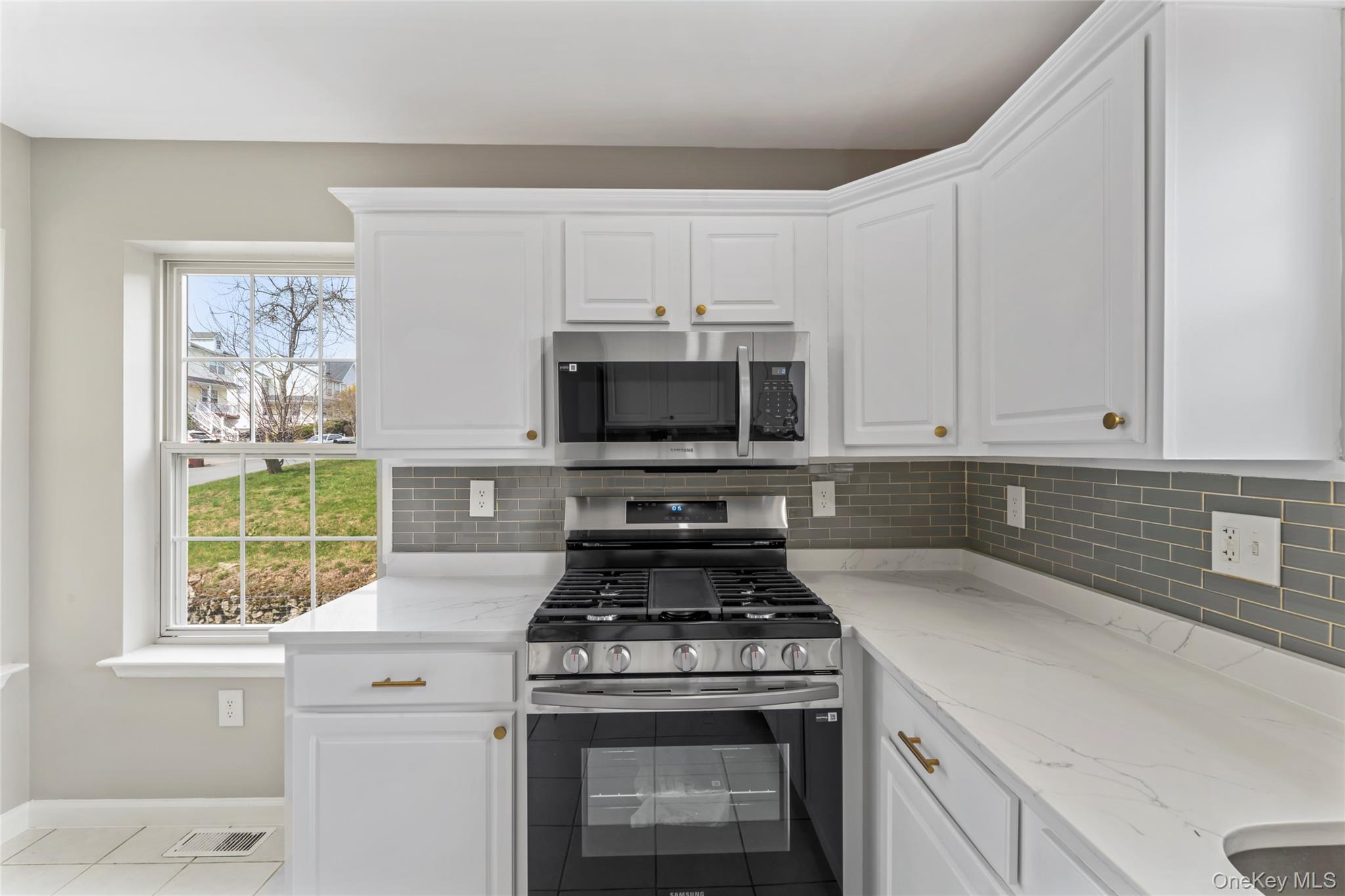 99 Evan Road Warwick, NY 10990 - Photo 10 of 27 a kitchen with granite countertop a stove and a sink