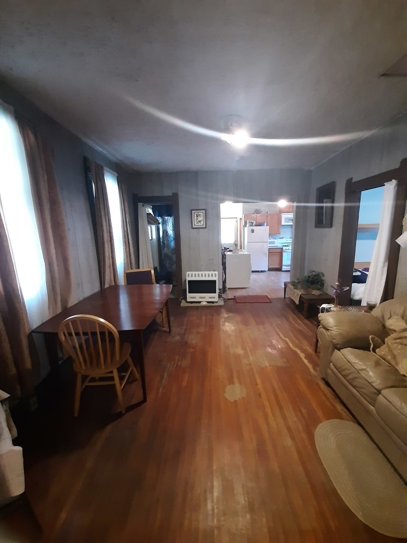 1402 South Wright Street Bloomington, IL 61701 - Photo 12 of 20 a living room with furniture and a gym machine