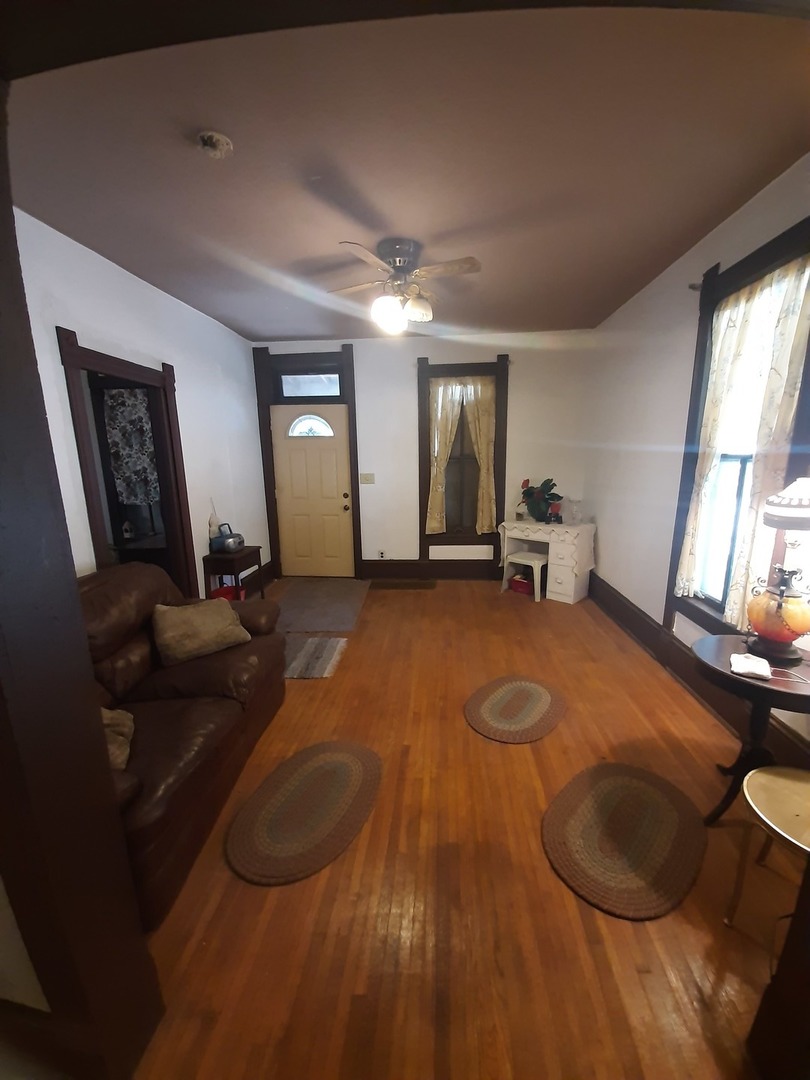 1402 South Wright Street Bloomington, IL 61701 - Photo 10 of 20 a living room with furniture and a wooden floor
