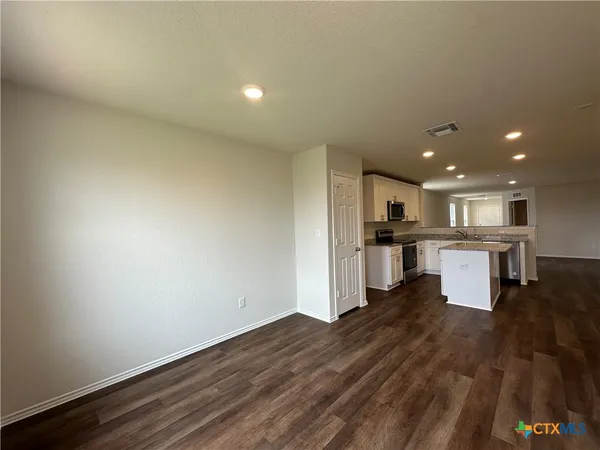 a view of kitchen with wooden floor