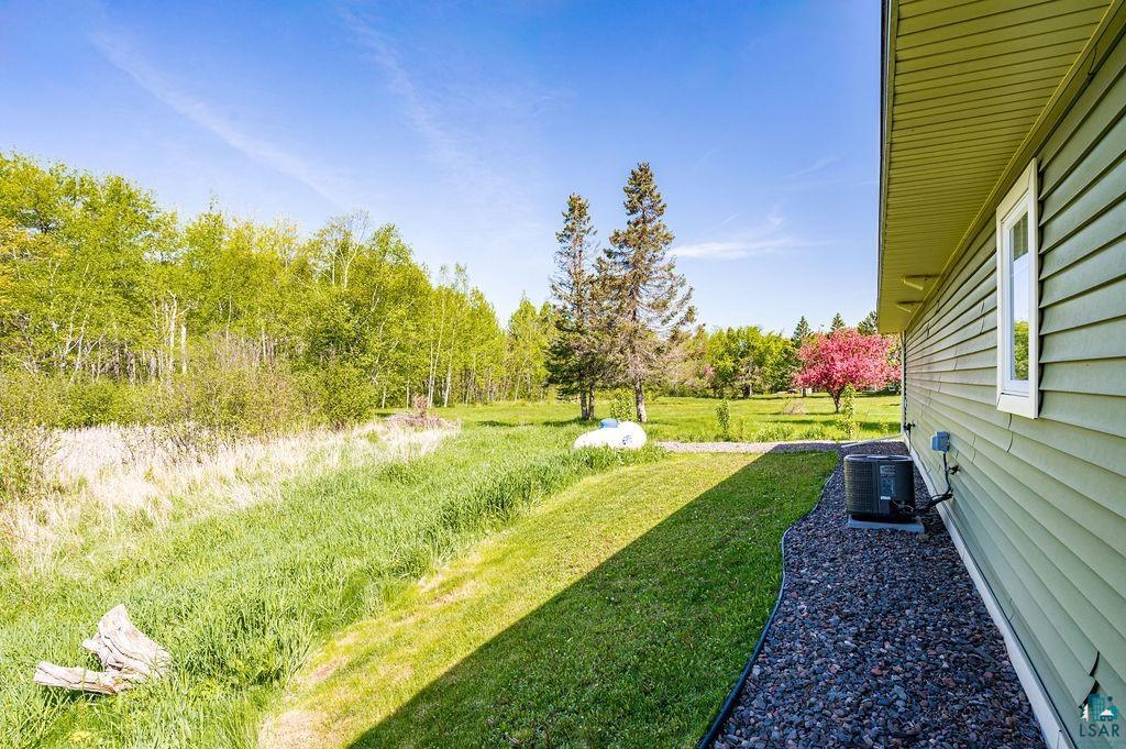 3825 Kenroy Road Hermantown, MN 55811 - Photo 23 of 28 View of yard featuring central air condition unit