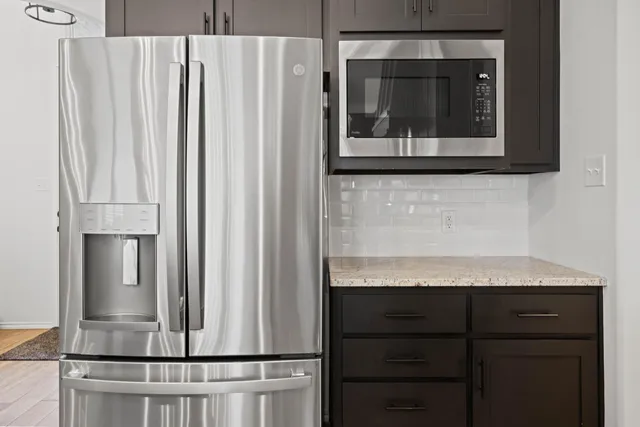 a view of a kitchen with a sink and cabinets