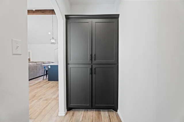 a view of a kitchen from the hallway