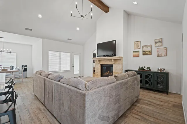 a living room with furniture fireplace and a flat screen tv