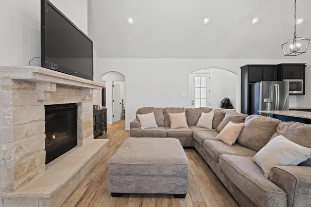 a living room with furniture and a fireplace