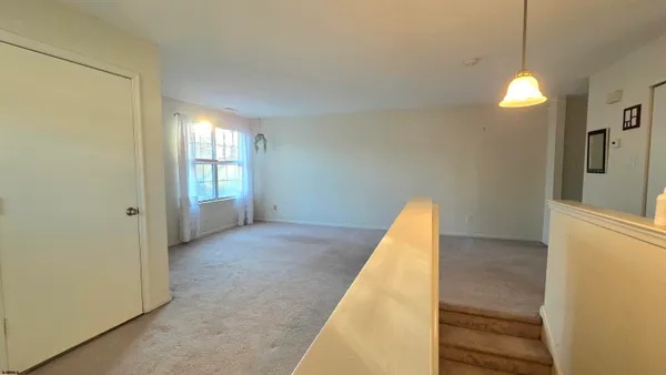 a view of a room with a staircase