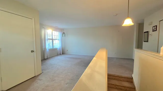 a view of a room with a staircase