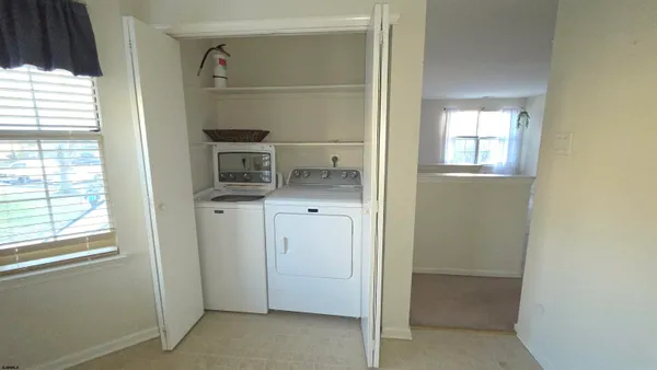 a view of hallway with washer and dryer