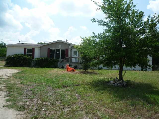 21109 Hogeye Road Manor, TX 78653 - Photo 1 of 1 a view of a house with backyard and garden