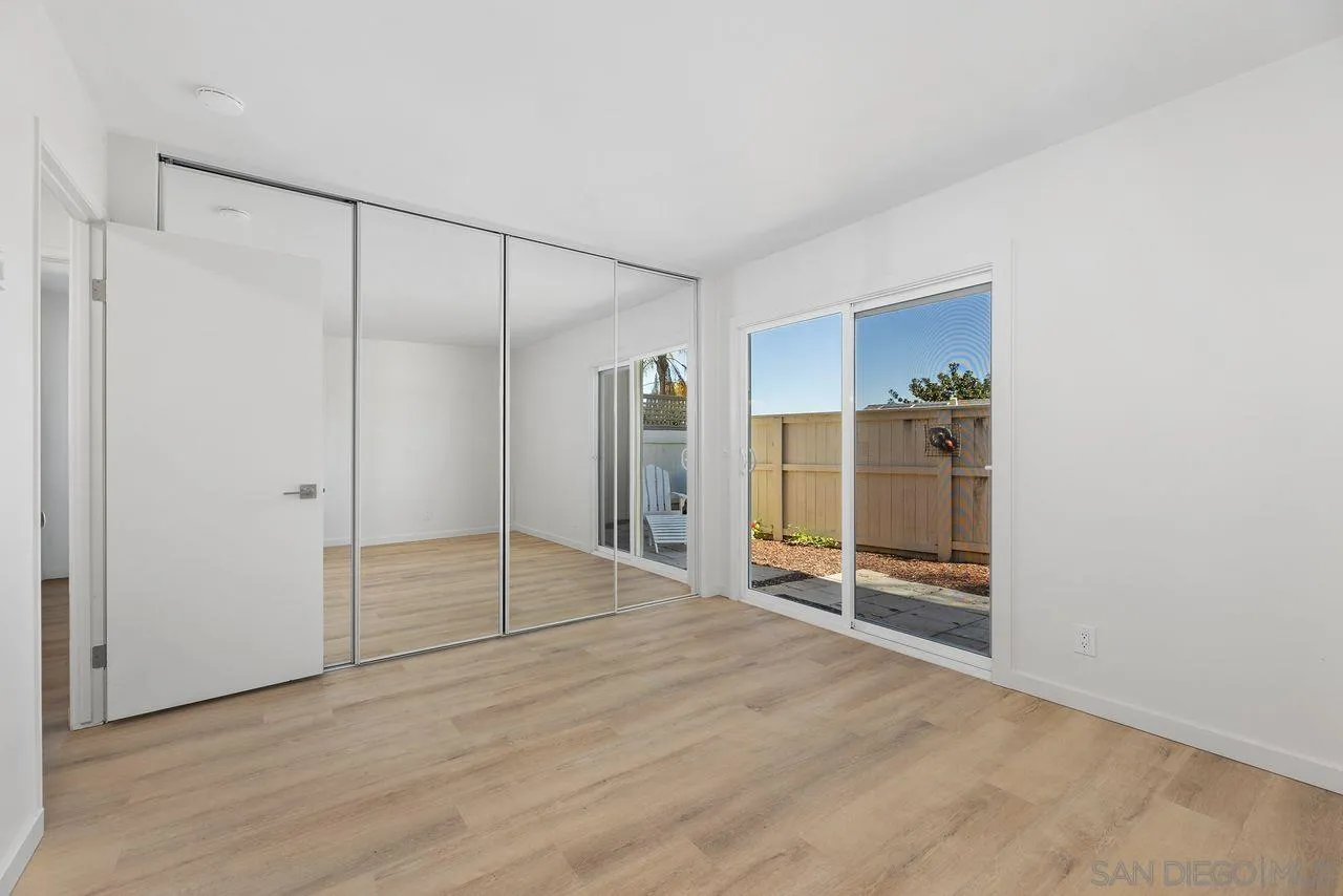 285 Aspenwood Lane Encinitas, CA 92024 - Photo 26 of 39 a view of an empty room with wooden floor and a bathroom