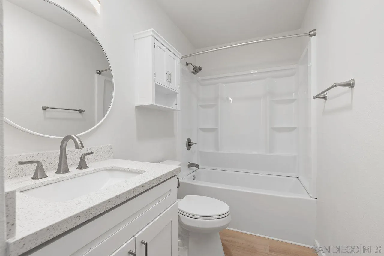 285 Aspenwood Lane Encinitas, CA 92024 - Photo 3 of 39 a bathroom with a sink a toilet and a bathtub