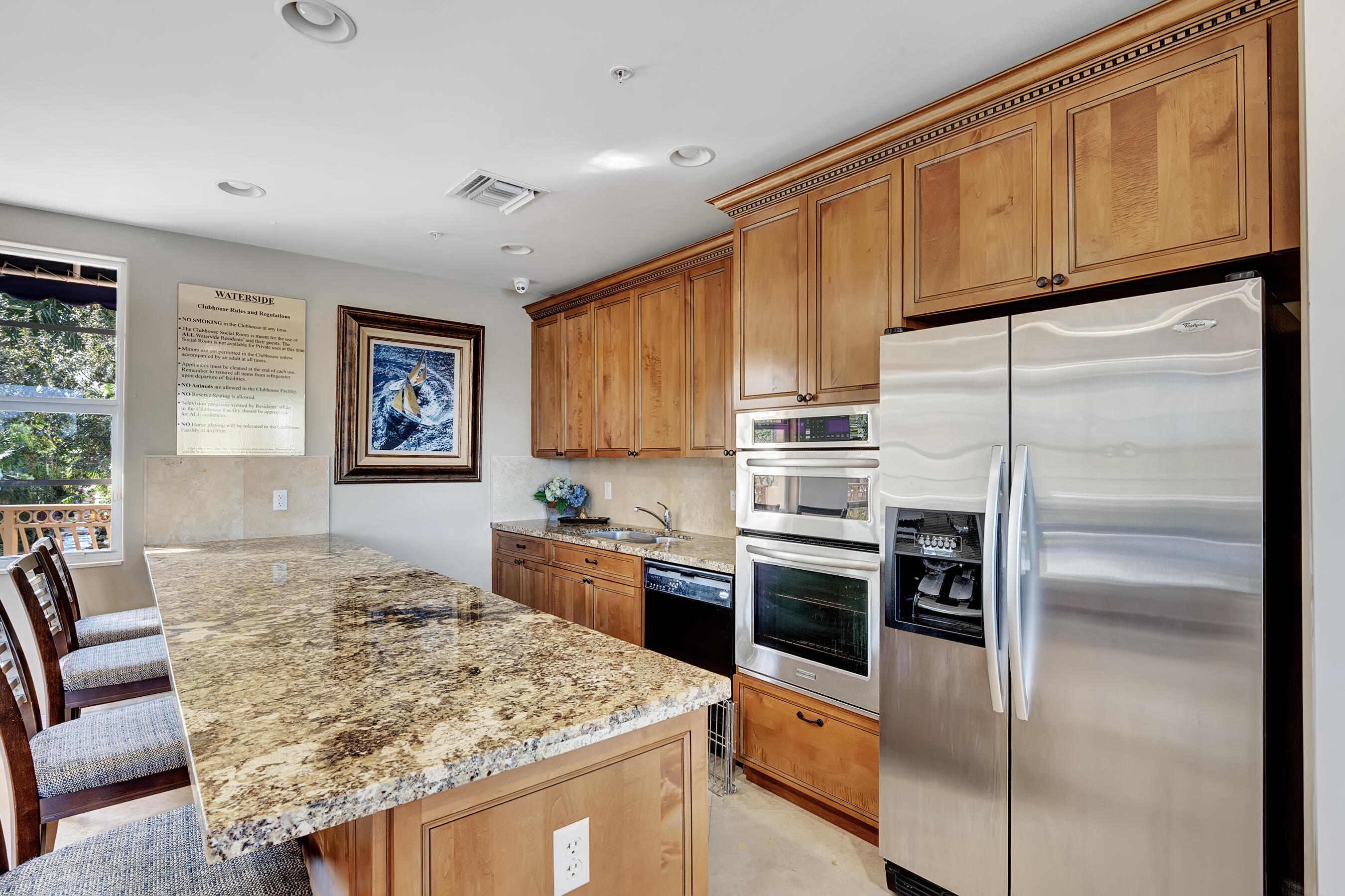 3061 Waterside Circle Boynton Beach, FL 33435 - Photo 24 of 39 a kitchen with stainless steel appliances granite countertop a refrigerator a stove a sink and a refrigerator