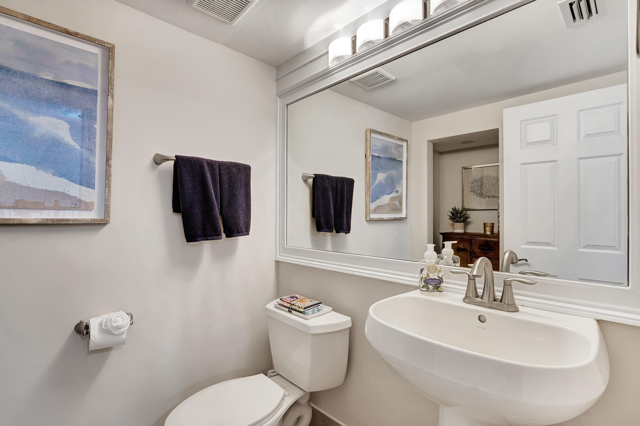 3061 Waterside Circle Boynton Beach, FL 33435 - Photo 30 of 39 a bathroom with a toilet a sink and mirror