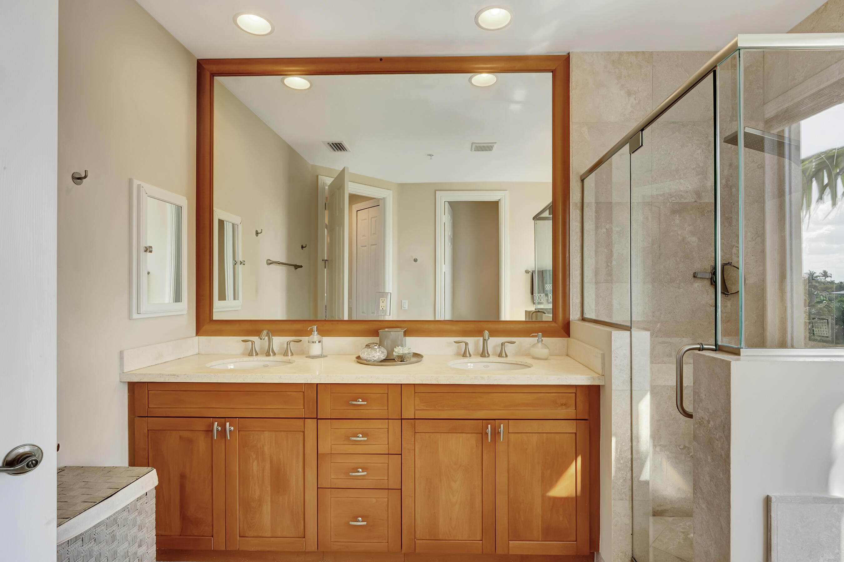3061 Waterside Circle Boynton Beach, FL 33435 - Photo 33 of 39 a bathroom with a sink vanity granite shower and a mirror