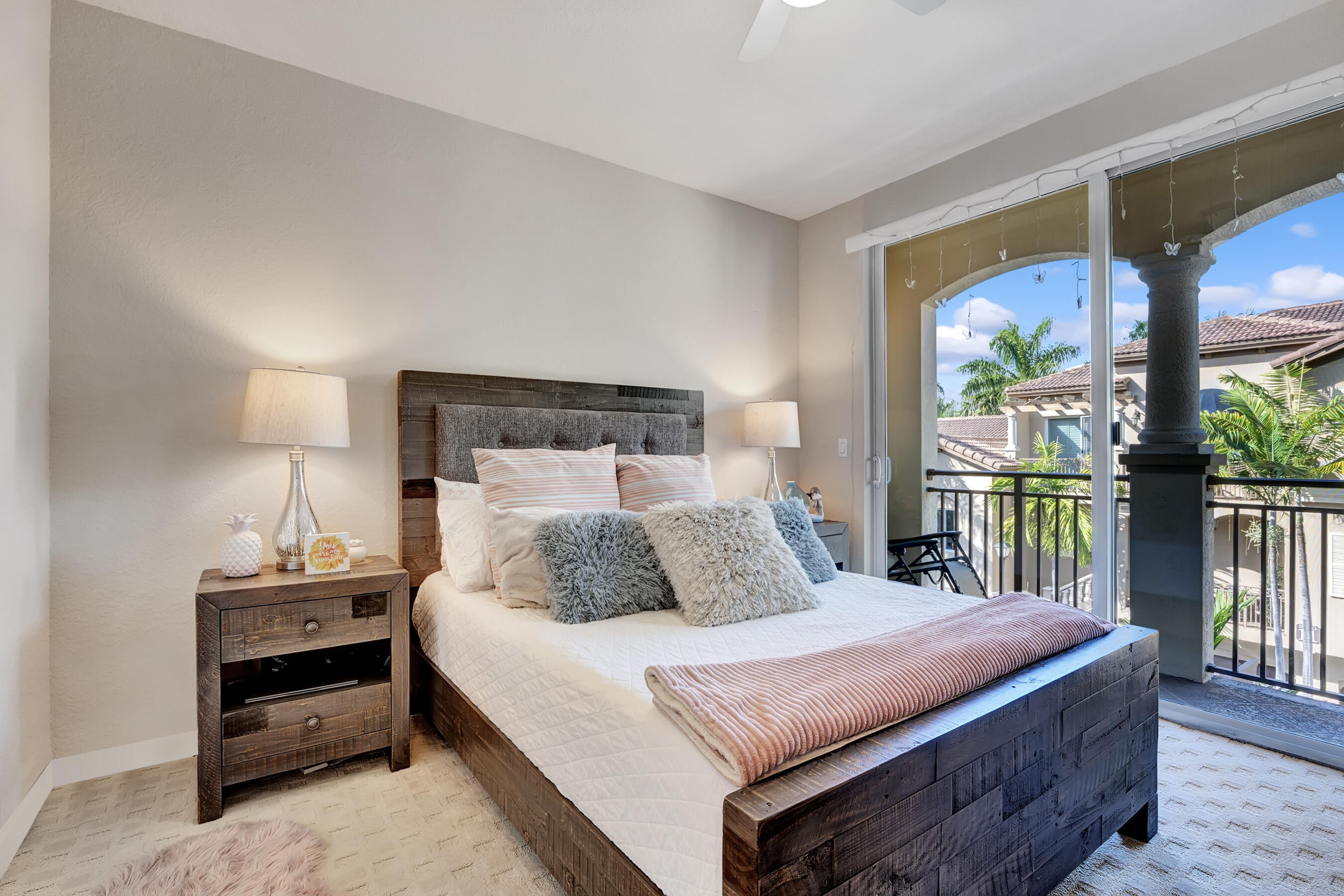 3061 Waterside Circle Boynton Beach, FL 33435 - Photo 35 of 39 a bedroom with a bed and a large window