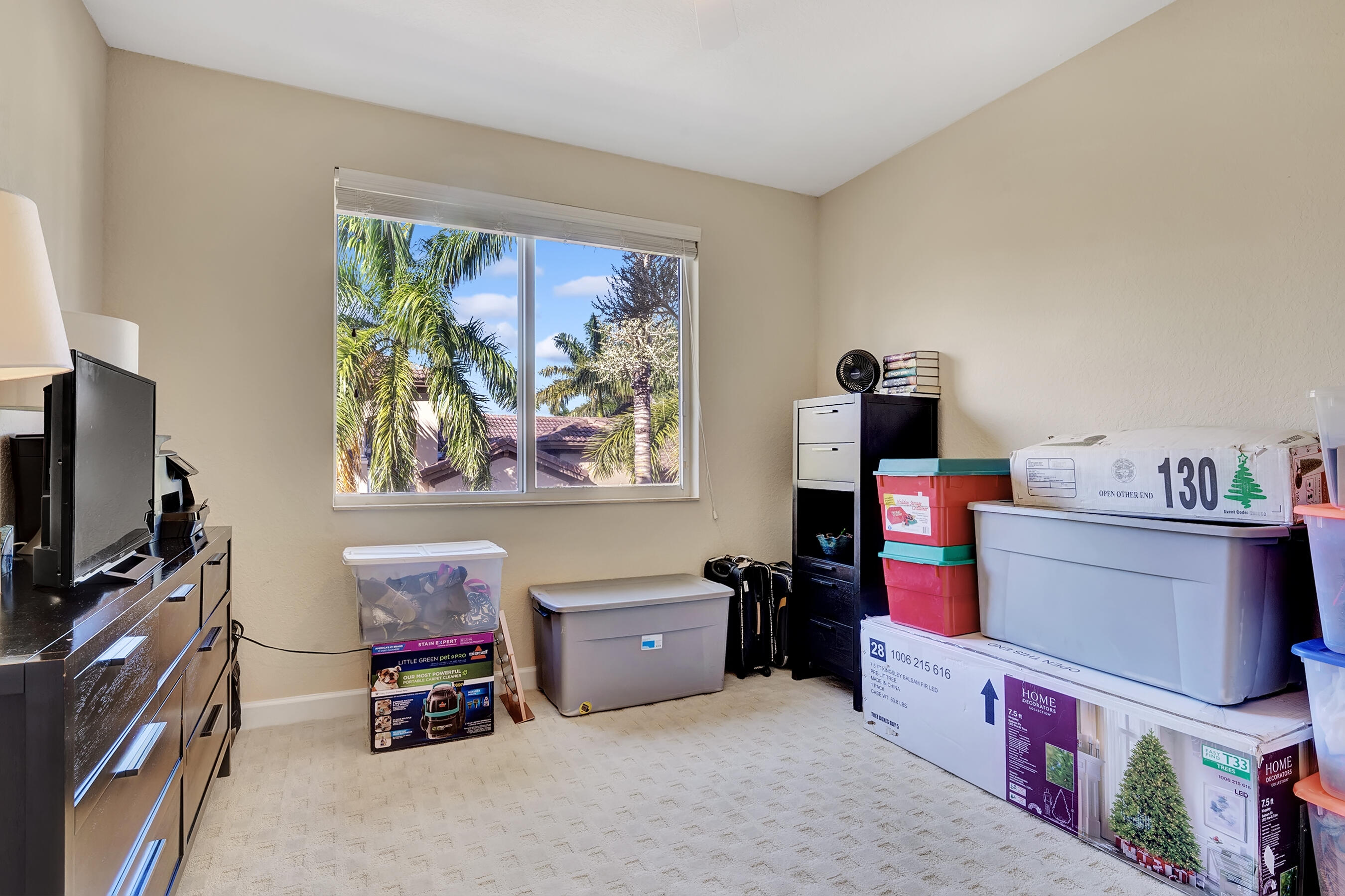 3061 Waterside Circle Boynton Beach, FL 33435 - Photo 36 of 39 a room with furniture and a flat screen tv