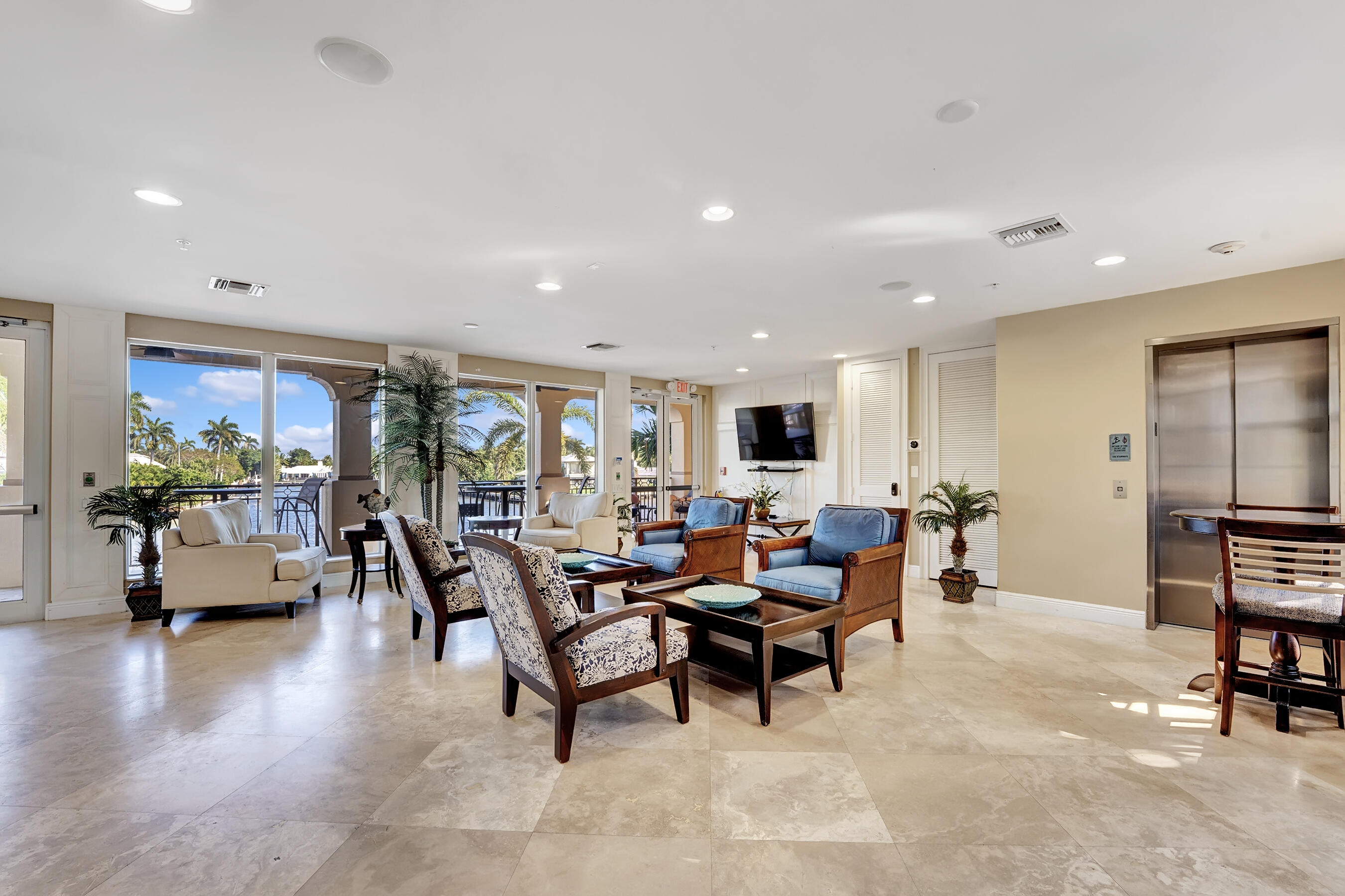 3061 Waterside Circle Boynton Beach, FL 33435 - Photo 37 of 39 a living room with furniture and a flat screen tv