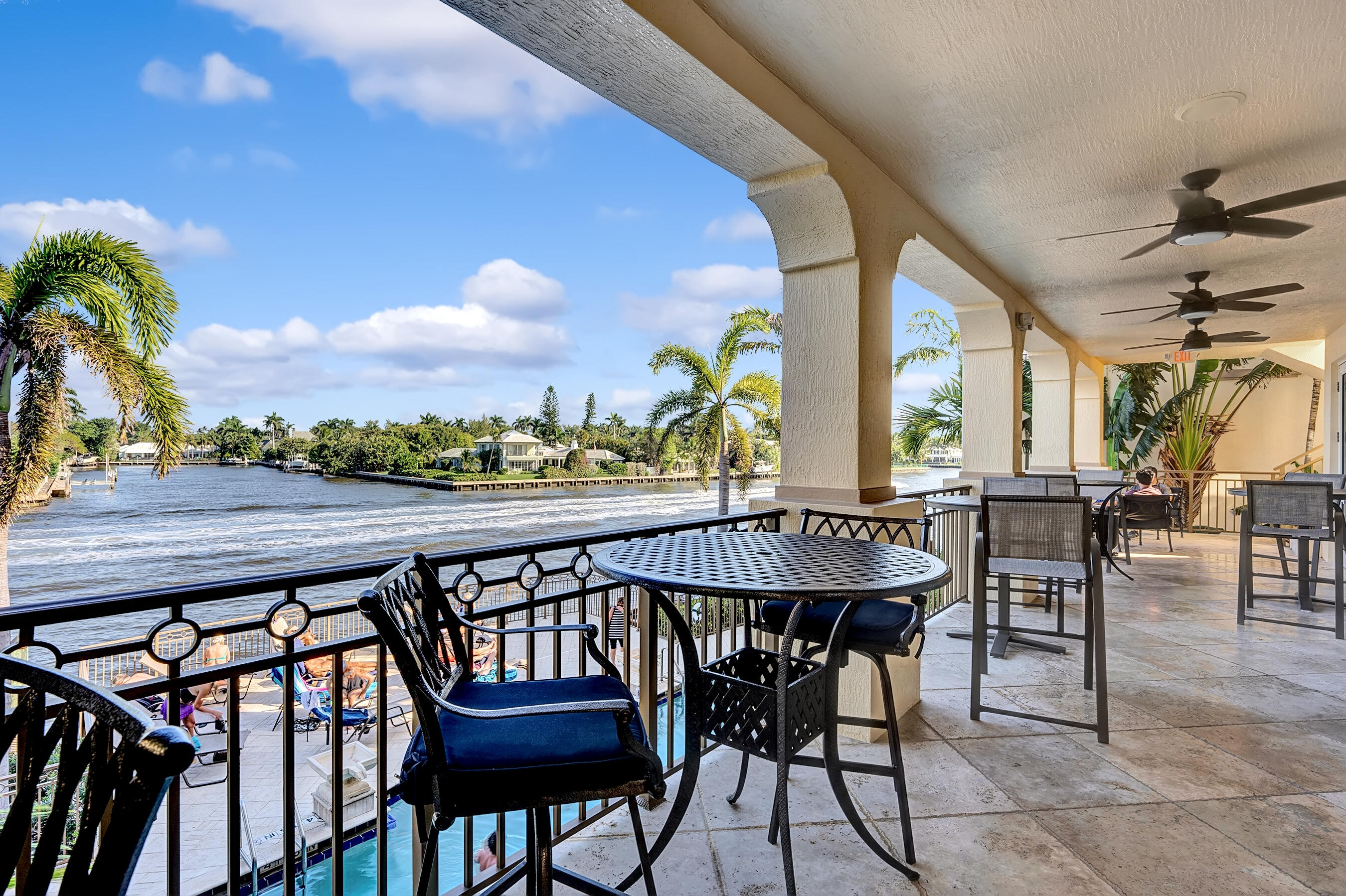 3061 Waterside Circle Boynton Beach, FL 33435 - Photo 38 of 39 a view of a patio with a table and chairs