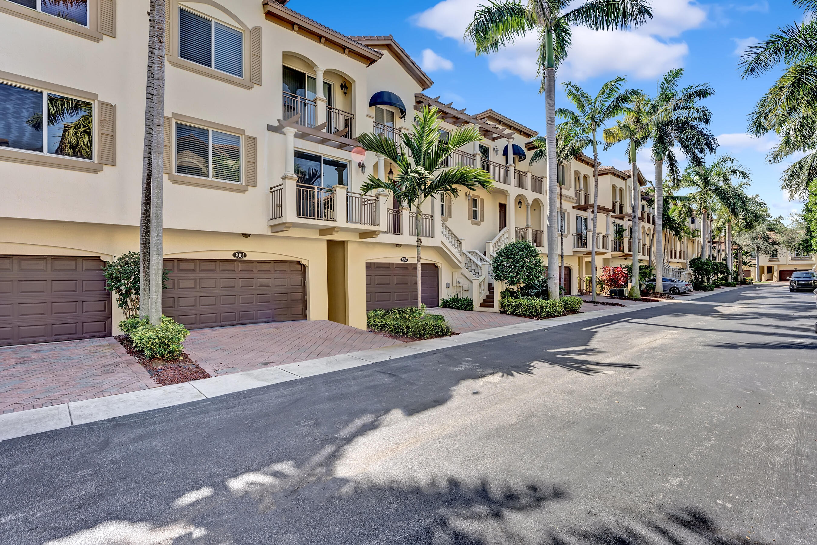 3061 Waterside Circle Boynton Beach, FL 33435 - Photo 6 of 39 a front view of a multi story building with yard