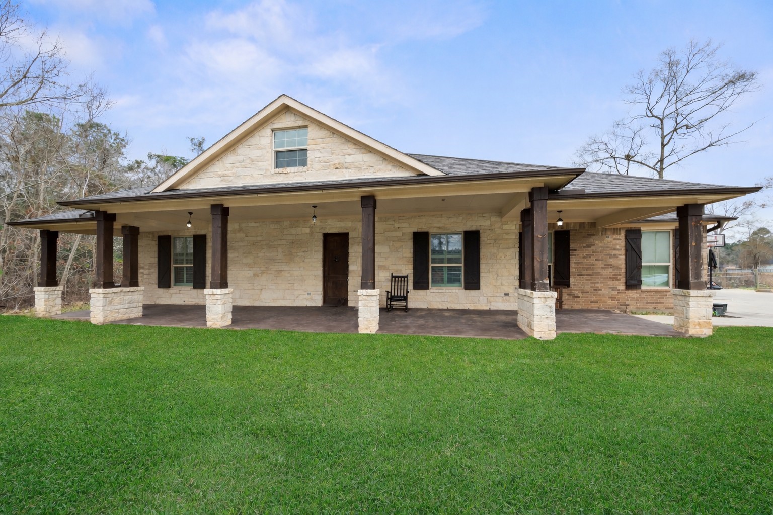 120 County Road Splendora, TX 77372 - Photo 2 of 30 This photo is virtually staged to remove some of the items from the front porch