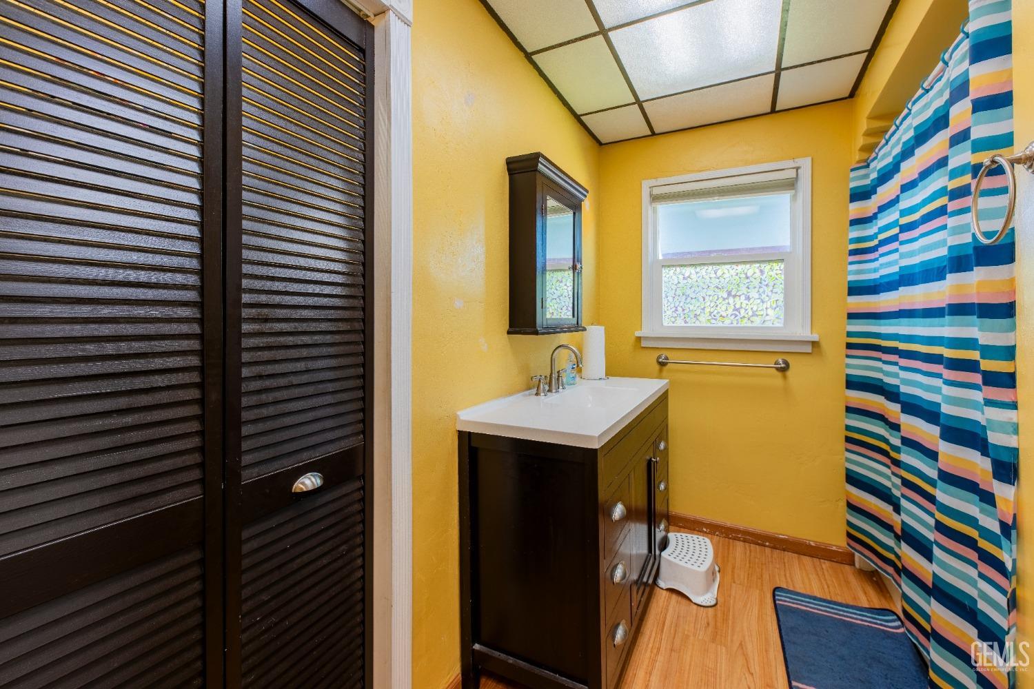 Undisclosed Address Bakersfield, CA 93305 - Photo 20 of 27 a bathroom with a sink and a mirror