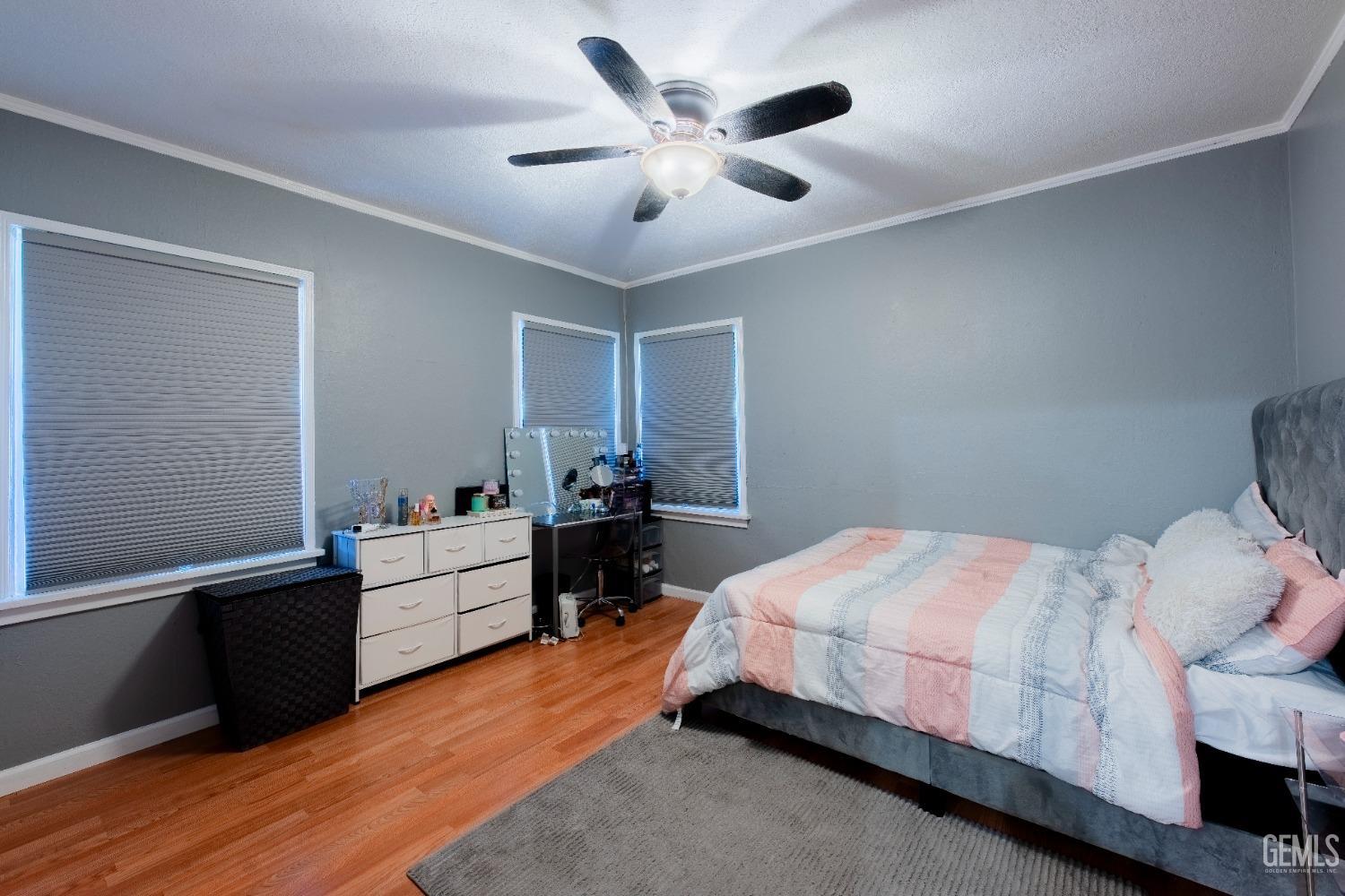 Undisclosed Address Bakersfield, CA 93305 - Photo 21 of 27 a bedroom with a bed and a desk