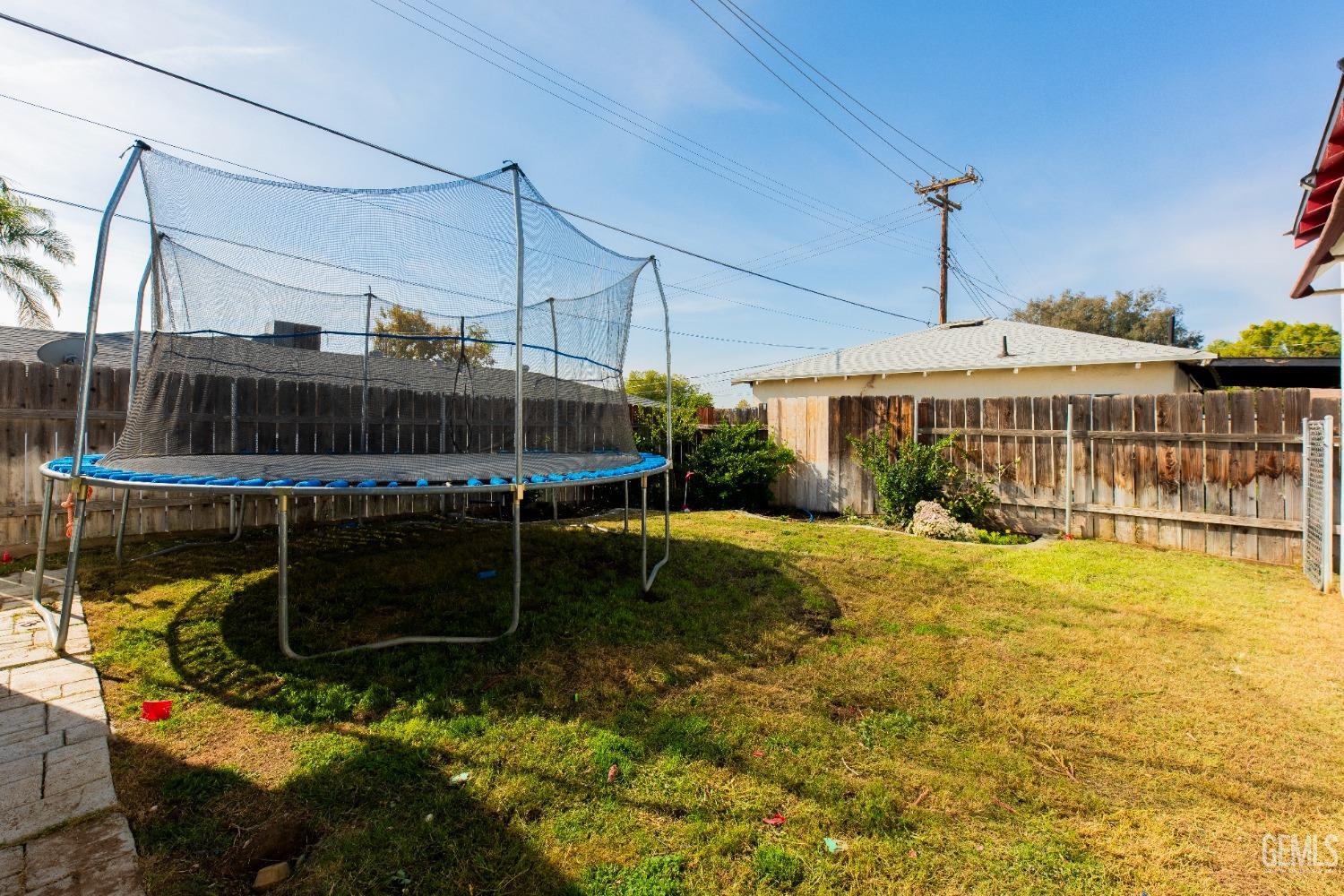 Undisclosed Address Bakersfield, CA 93305 - Photo 25 of 27 a view of a swimming pool with a patio