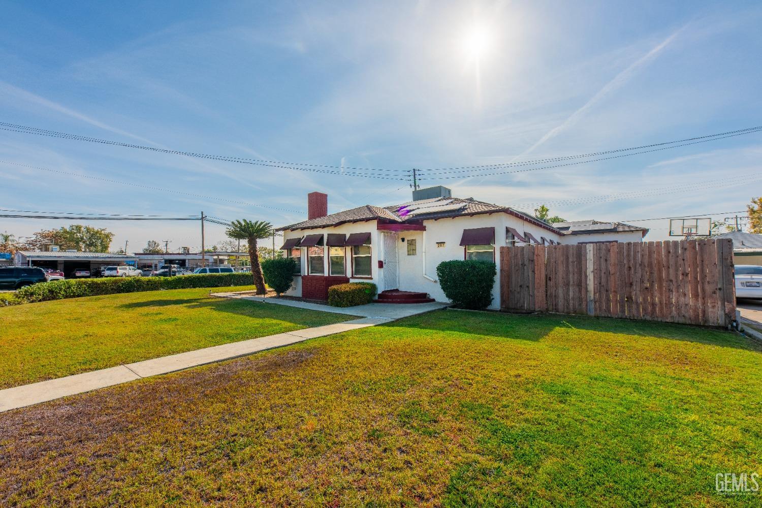 Undisclosed Address Bakersfield, CA 93305 - Photo 3 of 27 a view of a house with swimming pool and yard