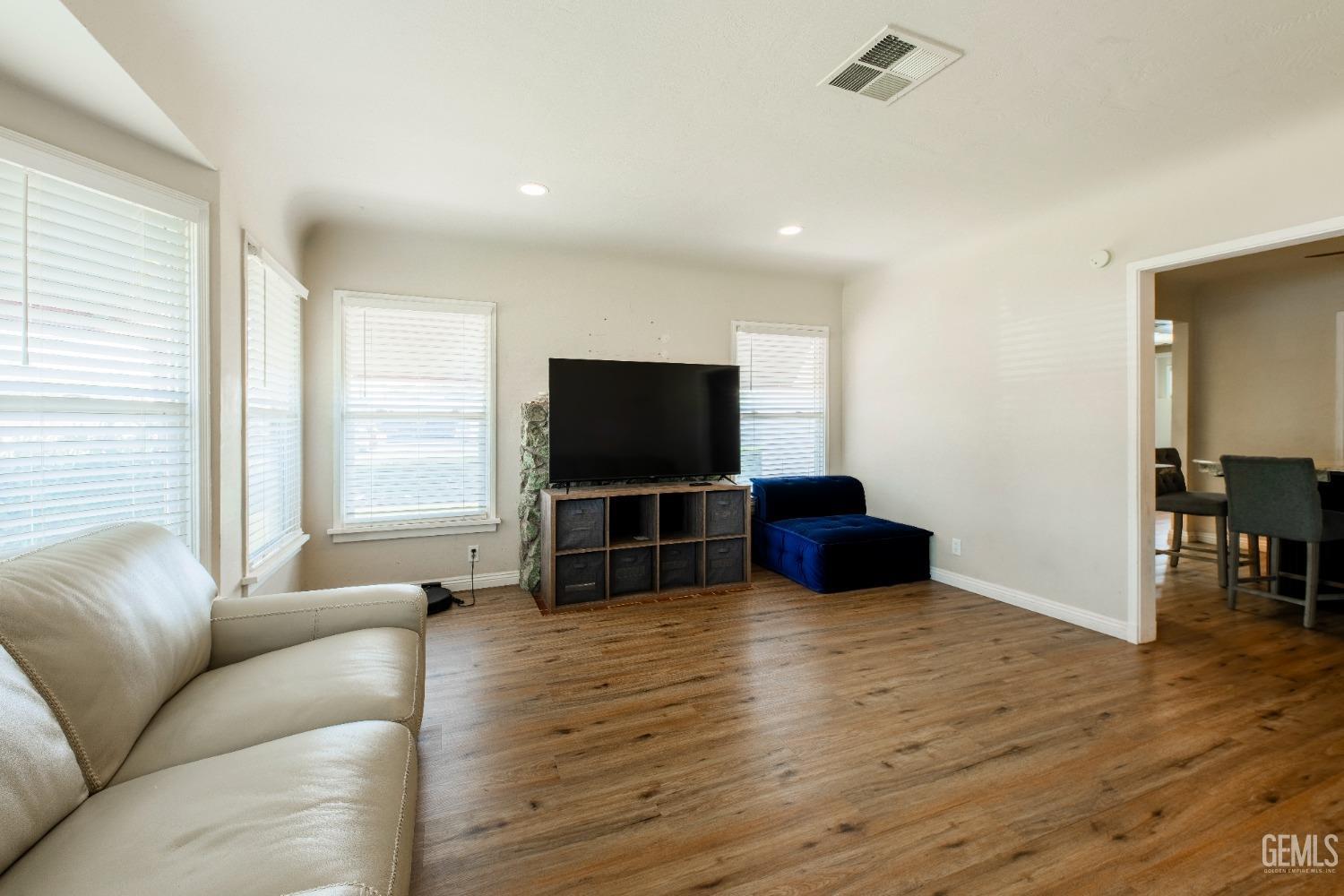 Undisclosed Address Bakersfield, CA 93305 - Photo 4 of 27 a living room with furniture and a flat screen tv