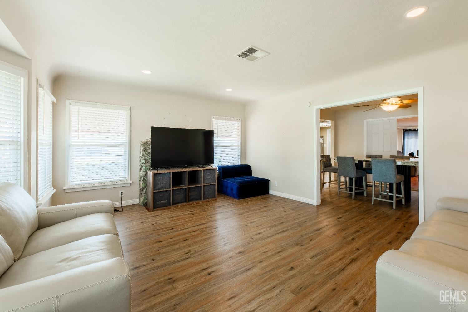 Undisclosed Address Bakersfield, CA 93305 - Photo 5 of 27 a living room with furniture and a flat screen tv
