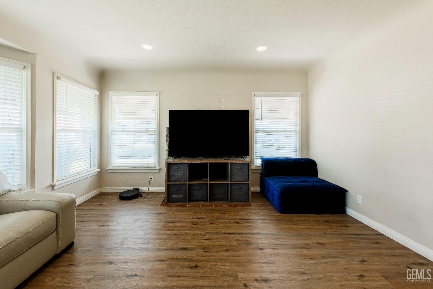 Undisclosed Address Bakersfield, CA 93305 - Photo 6 of 27 a living room with furniture and a flat screen tv