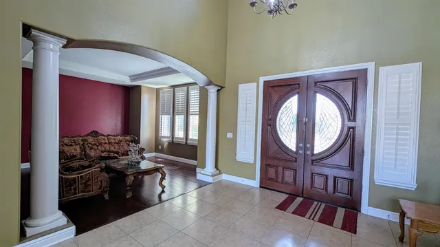 a living room with fireplace furniture and a window