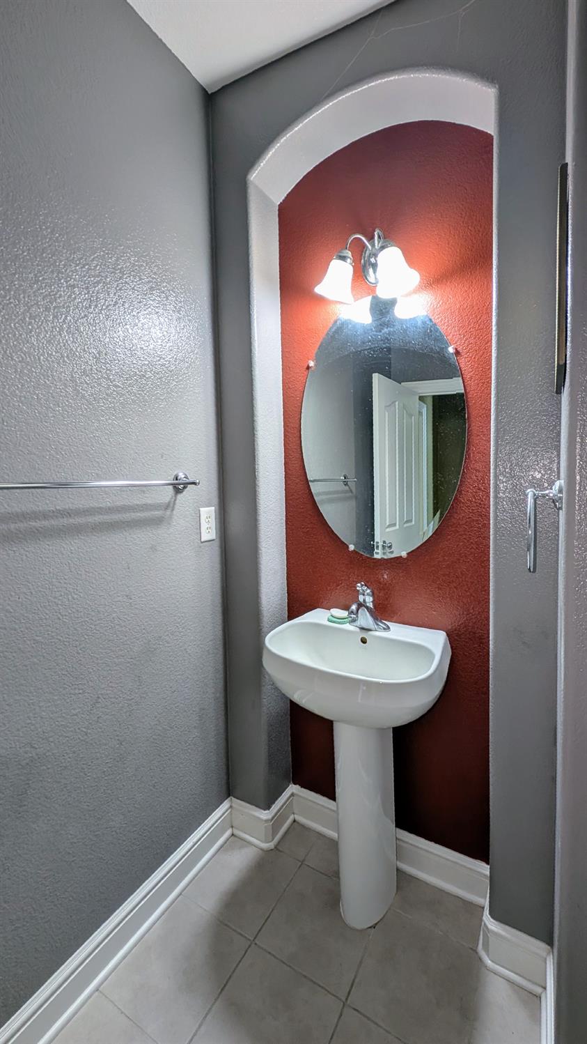 4389 Kilroy Court Rancho Cordova, CA 95742 - Photo 17 of 47 a bathroom with a sink and a mirror