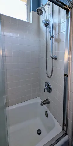 a spacious bathroom with a granite countertop sink and a mirror