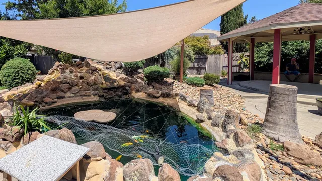 a white house with trees in front of it