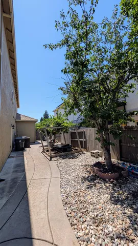 a house view with a garden space