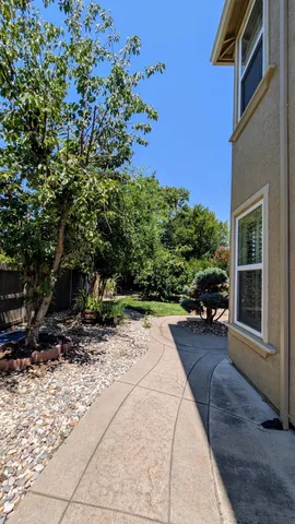 a bed sitting in front of a house