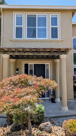 a view of a backyard with a patio