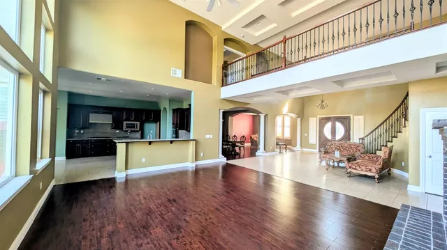 a view of an entryway with wooden floor