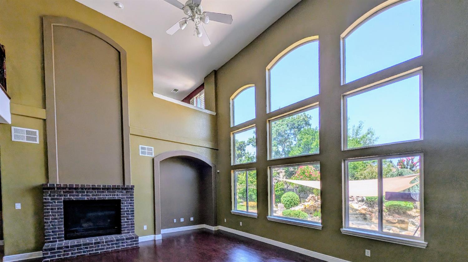 4389 Kilroy Court Rancho Cordova, CA 95742 - Photo 7 of 47 a view of an empty room with a fireplace and a window