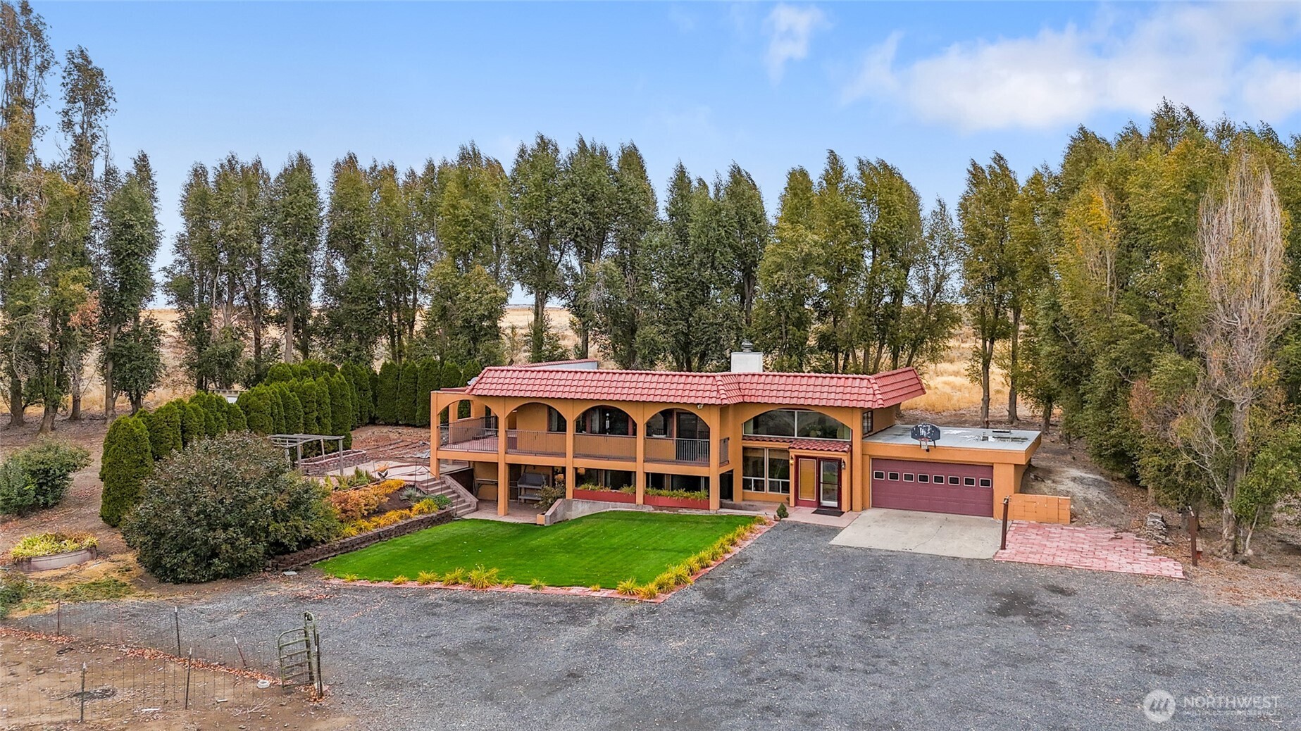 18850 Stratford Road Northeast Moses Lake, WA 98837 - Photo 1 of 40 a view of a house with a yard in front of it