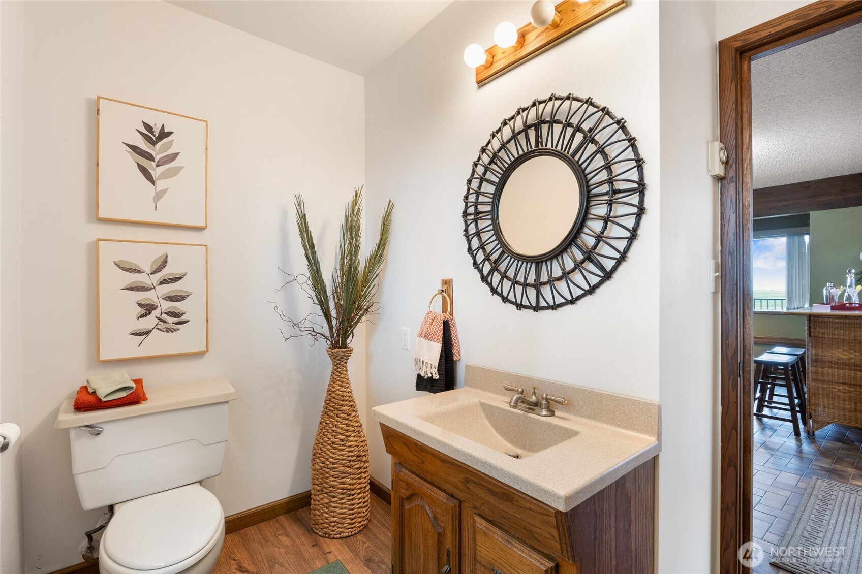 18850 Stratford Road Northeast Moses Lake, WA 98837 - Photo 14 of 40 a bathroom with a toilet a sink and a mirror