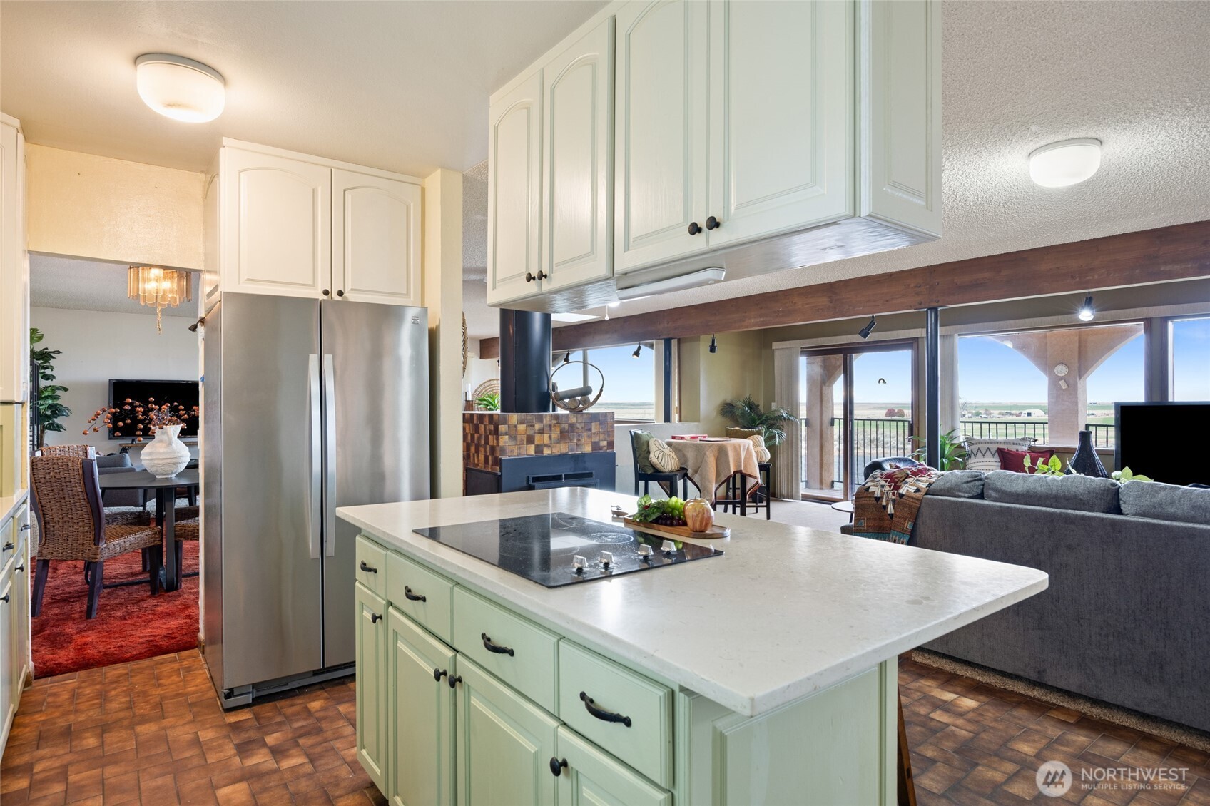 18850 Stratford Road Northeast Moses Lake, WA 98837 - Photo 21 of 40 a kitchen with stainless steel appliances granite countertop a sink a stove and a refrigerator