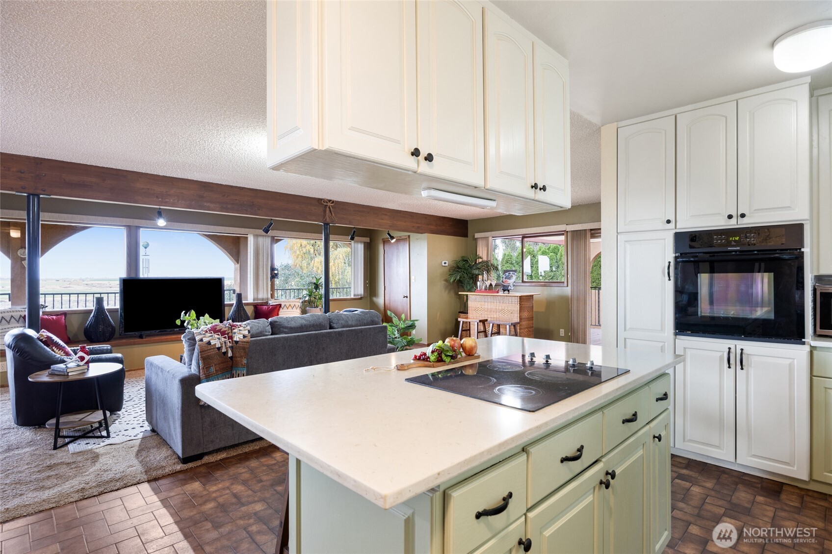 18850 Stratford Road Northeast Moses Lake, WA 98837 - Photo 22 of 40 a kitchen with stainless steel appliances a sink a stove and a microwave